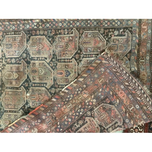 383 - A large Persian style carpet, with all over brown ground and geometric pattern and borders, and much... 