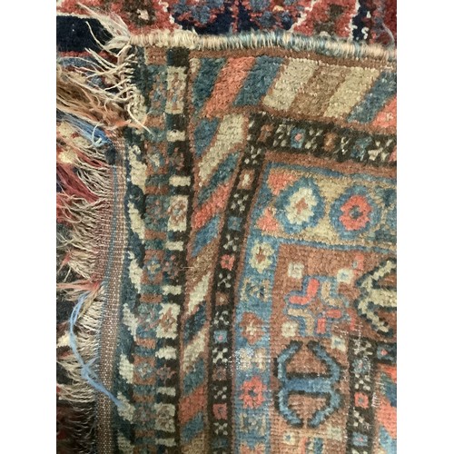 383 - A large Persian style carpet, with all over brown ground and geometric pattern and borders, and much... 