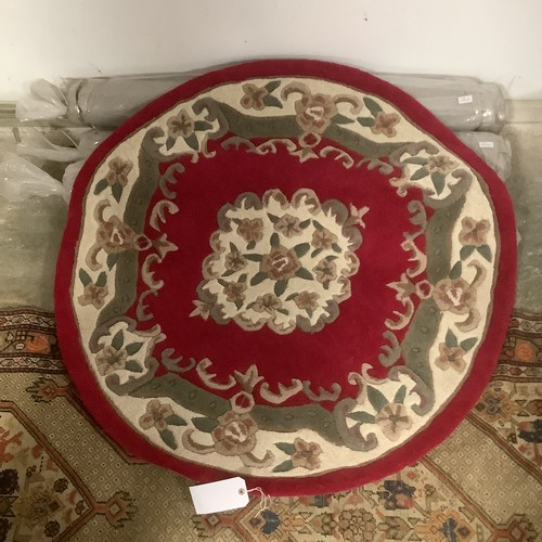 388 - Four 100% wool circular rugs 118cm, 2 green, 2 red. As New.