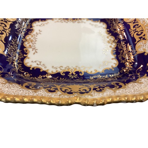 110 - A quantity of decorative blue and gilded china to include T Goode & Co London Bone China  Minton ova... 