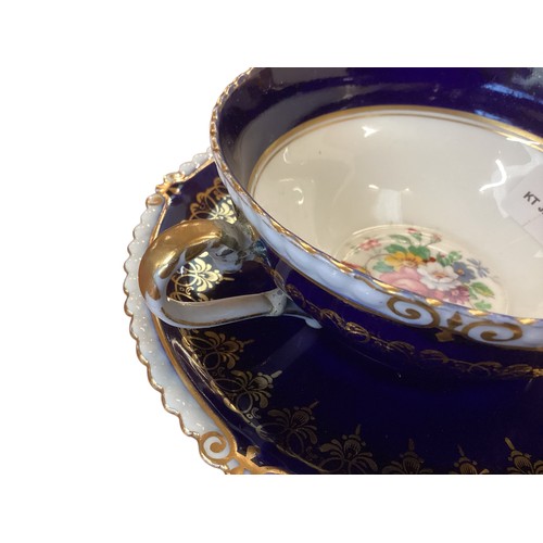 110 - A quantity of decorative blue and gilded china to include T Goode & Co London Bone China  Minton ova... 