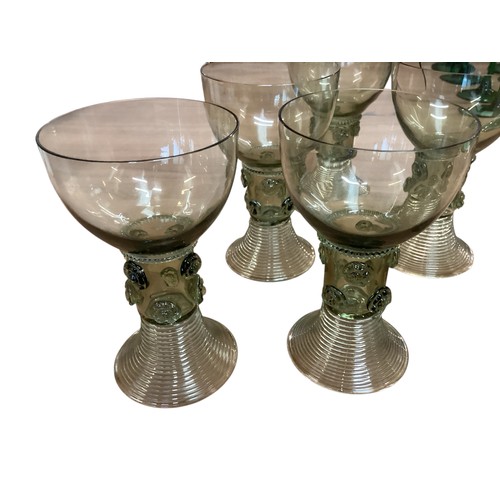 113 - A set of green and clear coloured hock glasses, and a set of C19th Green Roemers goblets with ribbed... 