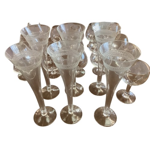 112 - A quantity of glassware to include a good set of six etched fluted champagne glasses, 4 purple wine ... 