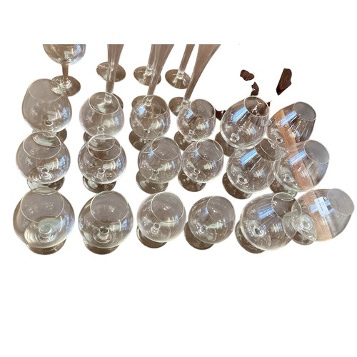 112 - A quantity of glassware to include a good set of six etched fluted champagne glasses, 4 purple wine ... 