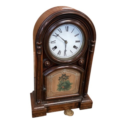 136 - Two clocks: A late C19th mahogany domed mantle clock, label to door inside , New Haven Clock etc, se... 