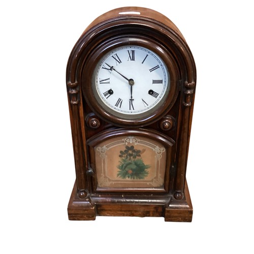 136 - Two clocks: A late C19th mahogany domed mantle clock, label to door inside , New Haven Clock etc, se... 