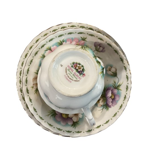 263 - A set of Royal Albert Bone china cups, saucers and plates, illustrated with a month for each set