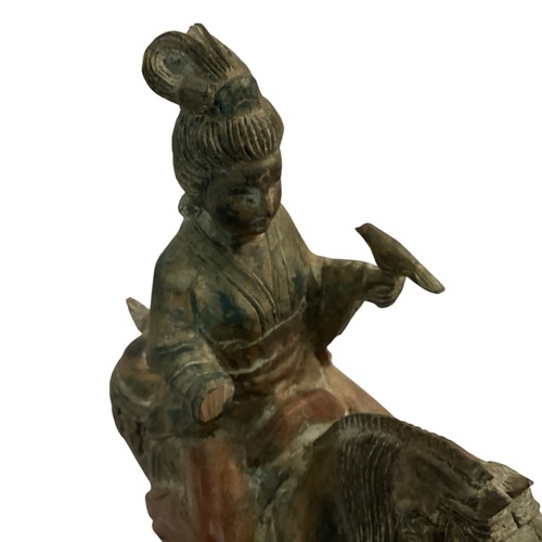 265 - A decorative wooden model of a horse and rider, in the style of a Chinese Tang horse. some damage to... 