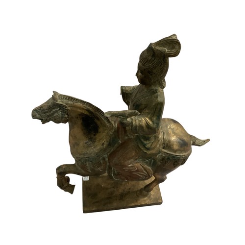 265 - A decorative wooden model of a horse and rider, in the style of a Chinese Tang horse. some damage to... 