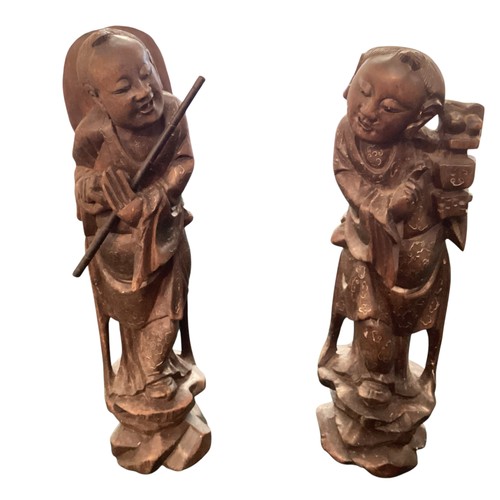 271 - A pair of carved wooden oriental figures, approx 30cm high