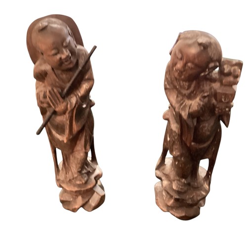 271 - A pair of carved wooden oriental figures, approx 30cm high