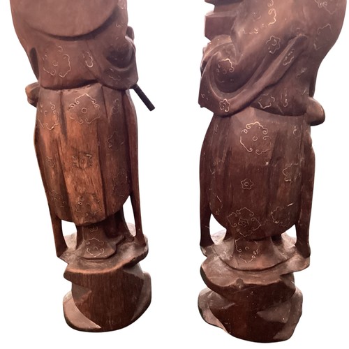 271 - A pair of carved wooden oriental figures, approx 30cm high