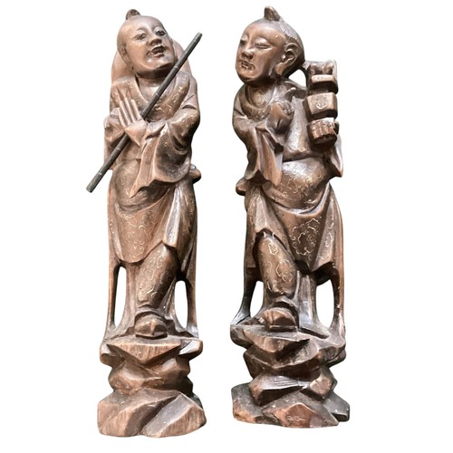 271 - A pair of carved wooden oriental figures, approx 30cm high