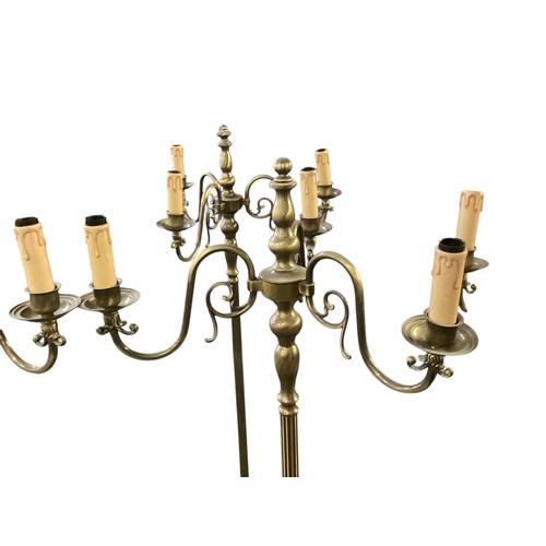 248 - A set of six brass column standard lamps each with 3 branches to faux candles. wired (not tested)