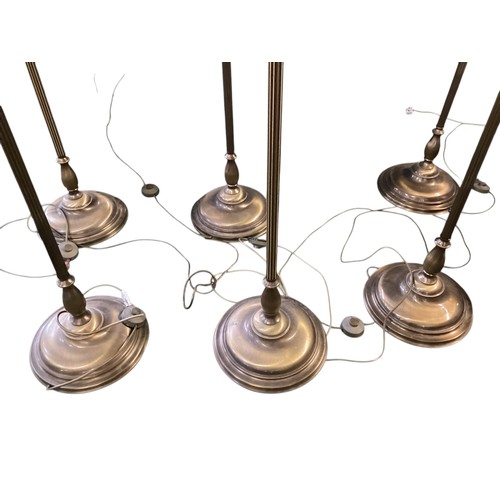 248 - A set of six brass column standard lamps each with 3 branches to faux candles. wired (not tested)