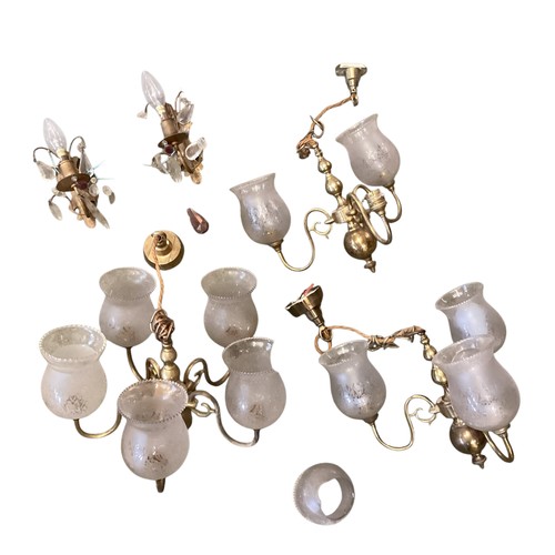 153 - A quantity of lighting to include brass five branch chandeliers  with etched shades