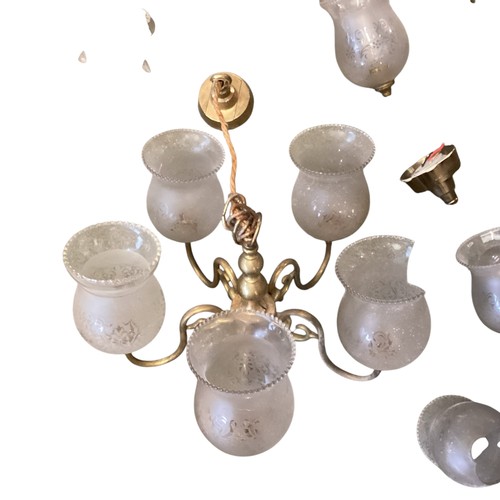 153 - A quantity of lighting to include brass five branch chandeliers  with etched shades