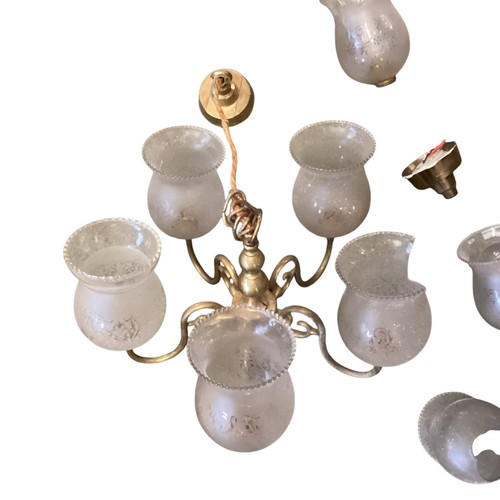 153 - A quantity of lighting to include brass five branch chandeliers  with etched shades