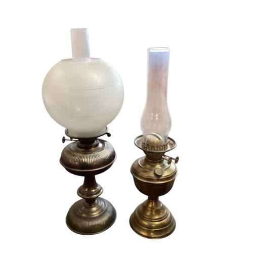 164 - A quantity of vintage lamps, to include brass and glass lamps, and four oil lamps with glass shades