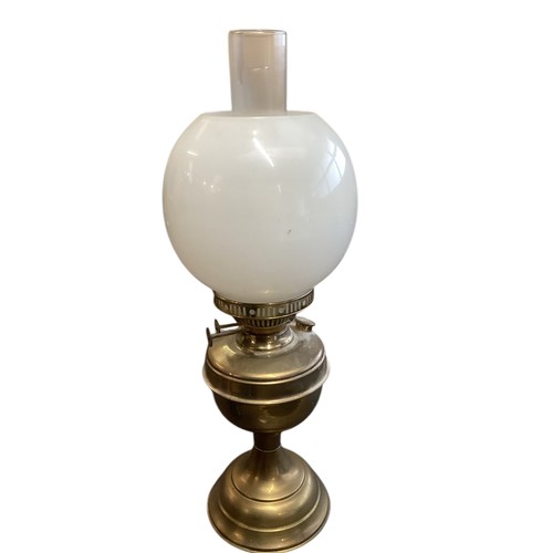 164 - A quantity of vintage lamps, to include brass and glass lamps, and four oil lamps with glass shades