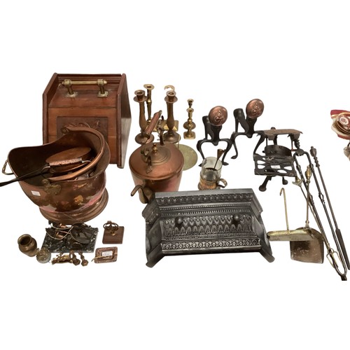 163 - A quantity of brass and copper wares, to include coal scuttles, candlesticks, large teapots, chestnu... 