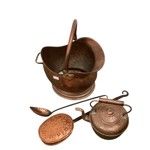 163 - A quantity of brass and copper wares, to include coal scuttles, candlesticks, large teapots, chestnu... 