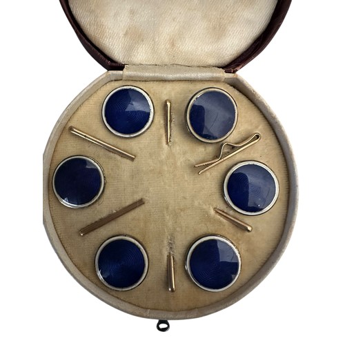 4 - A fitted circular cased presentation box containing 6 blue enamel style circular studs