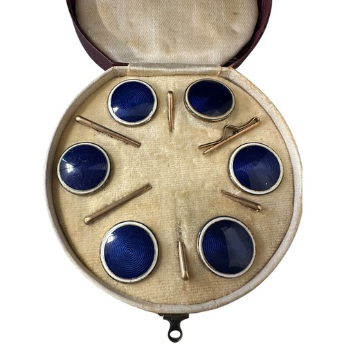 4 - A fitted circular cased presentation box containing 6 blue enamel style circular studs