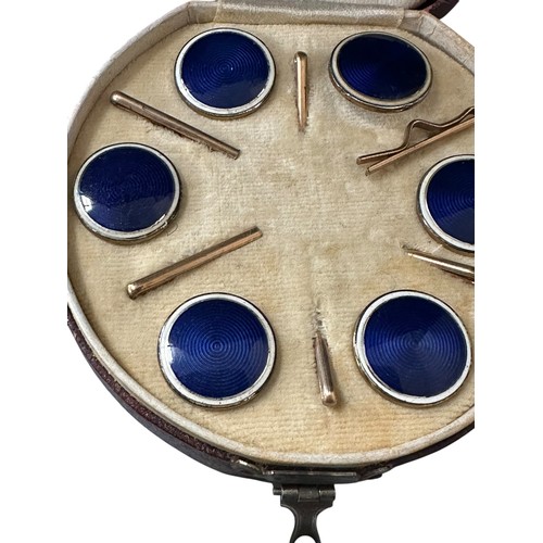 4 - A fitted circular cased presentation box containing 6 blue enamel style circular studs