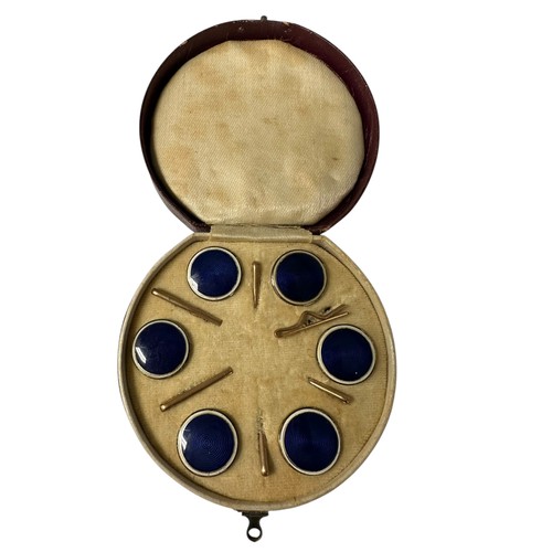 4 - A fitted circular cased presentation box containing 6 blue enamel style circular studs