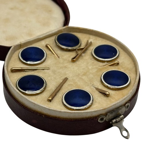 4 - A fitted circular cased presentation box containing 6 blue enamel style circular studs