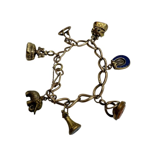 6 - A gold chain link bracelet stamped 9ct, with 7 charms