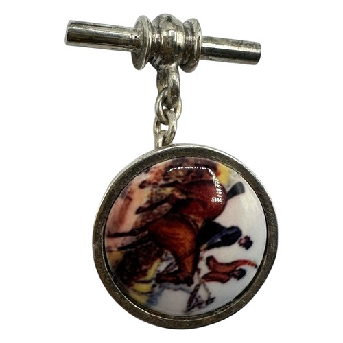 54 - A pair of silver cufflinks illustrated with equestrian hunting scenes