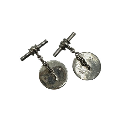 54 - A pair of silver cufflinks illustrated with equestrian hunting scenes