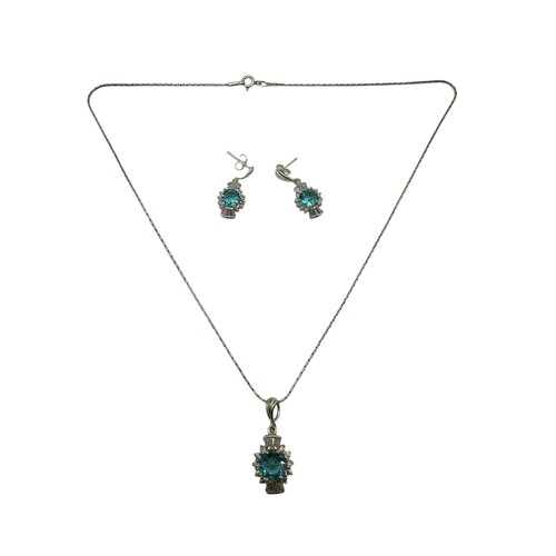 55 - A silver necklace with pendant, thistle shaped with blue stone, and matching earrings