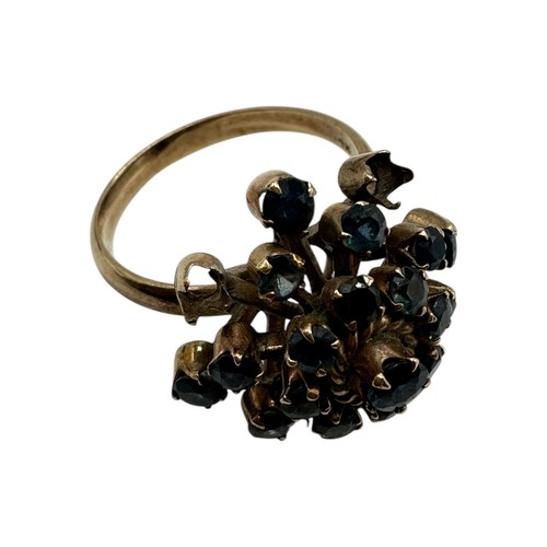 11 - A 14ct gold and sapphire cluster ring. Profusely set with single cut sapphires. Size O. 4.4g.