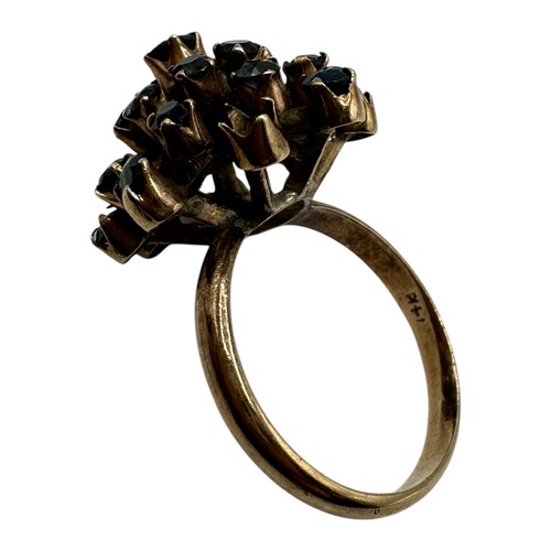 11 - A 14ct gold and sapphire cluster ring. Profusely set with single cut sapphires. Size O. 4.4g.