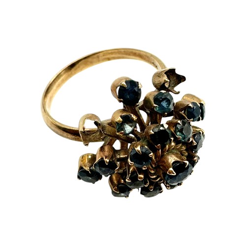 11 - A 14ct gold and sapphire cluster ring. Profusely set with single cut sapphires. Size O. 4.4g.