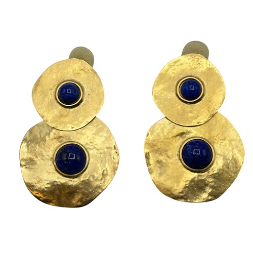 44 - A set of contemporary earrings, gold discs with blue central stones, in a Kenneth Jay Lane dust cove... 