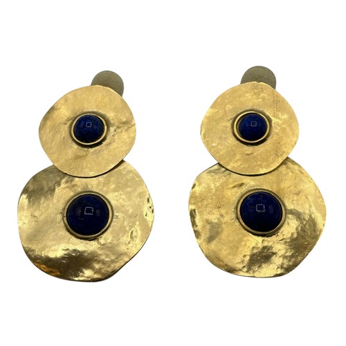 44 - A set of contemporary earrings, gold discs with blue central stones, in a Kenneth Jay Lane dust cove... 