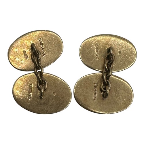 48 - A pair of oval, engraved hallmarked gold cufflinks, Stamped to verso TF Fennell 375. 11.2g (engraved... 