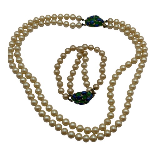 49 - A vintage matching pearl bracelet and double row pearl necklace, each with a blue and green stone de... 