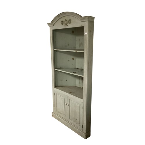 580 - A wooden painted corner cupboard with shelves, in the Adam taste, painted in a heritage moss green c... 