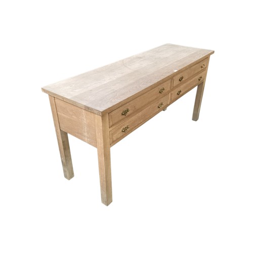 505 - Good quality heavy contemporary light oak side table of 4 drawers.  Wear and marks to the top commen... 