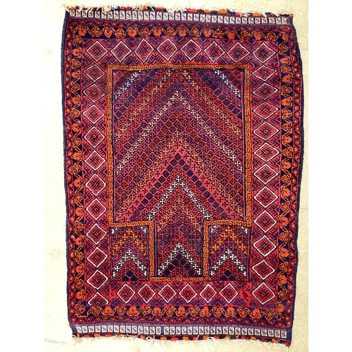 368 - Oriental wool handmade rug with embossed central design and a border. Main colours are red, blue and... 