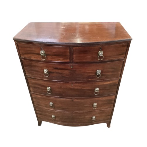 586 - A good bow fronted mahogany chest of two short and four long drawers with lion head ring handles.  1... 