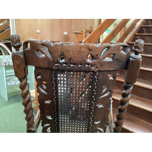 526 - Four chairs, to include a pair of Jacobean style bergere high back arm chairs, and two dining chairs... 