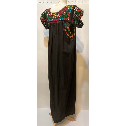 17 - A quantity of embroidered and Mexican clothing to include a black cotton embroidered dress labelled ... 