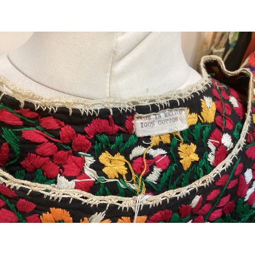 17 - A quantity of embroidered and Mexican clothing to include a black cotton embroidered dress labelled ... 