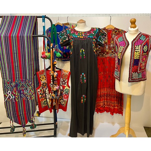 17 - A quantity of embroidered and Mexican clothing to include a black cotton embroidered dress labelled ... 